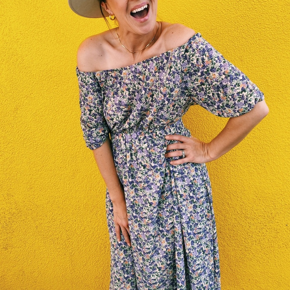 Medium. Entro floral dress. Purple, green, orange, ivory. Flowy, off shoulder!